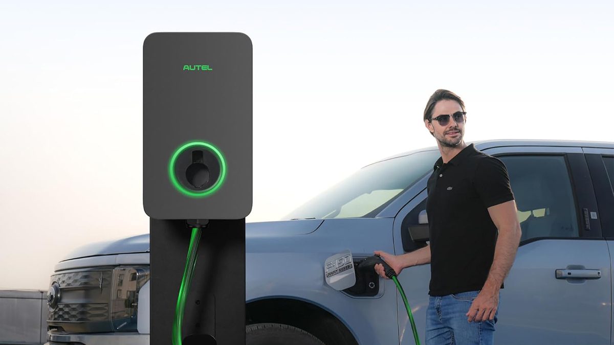 A man standing next to a car