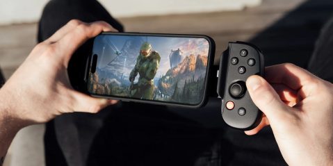 A person holding a phone with a game on it