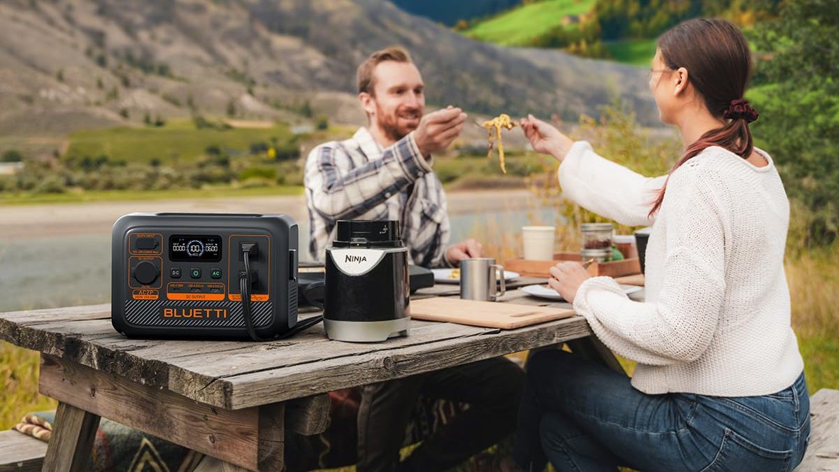 A group of people sitting at a table with food on it