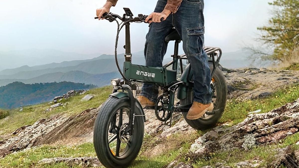 A man riding a bike on a hill