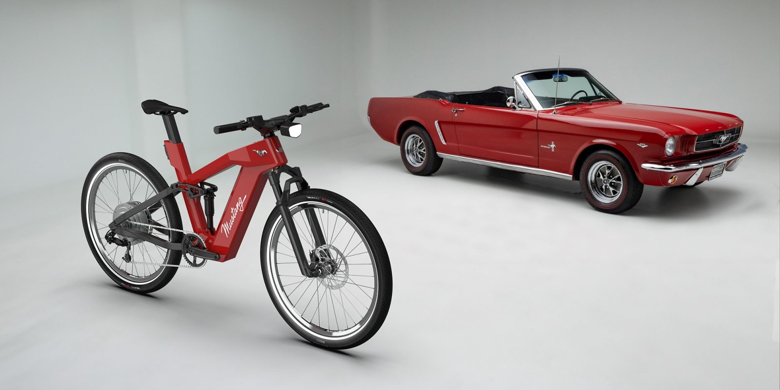 A red bike and a convertible