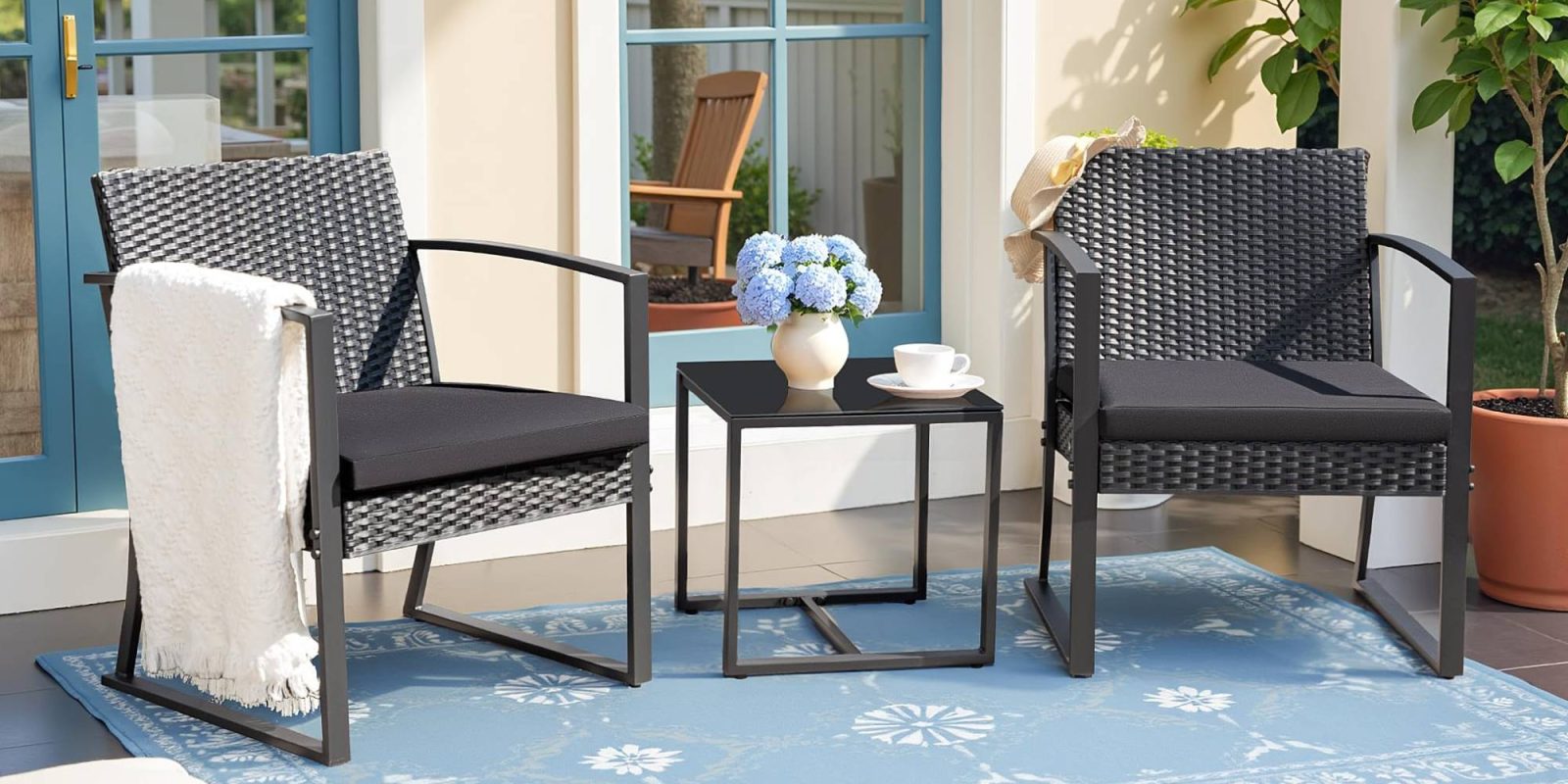 A group of chairs and a table on a porch