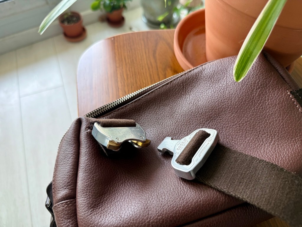 A seat belt on a brown bag