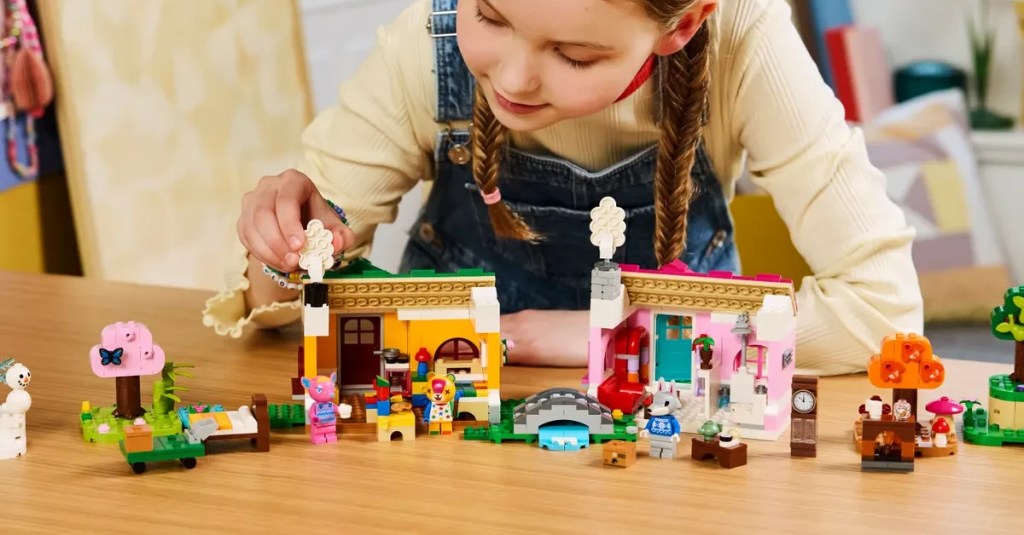 A girl playing with lego blocks
