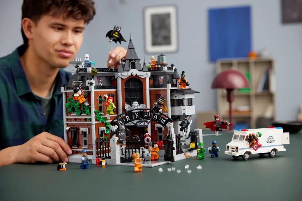 A man playing with legos