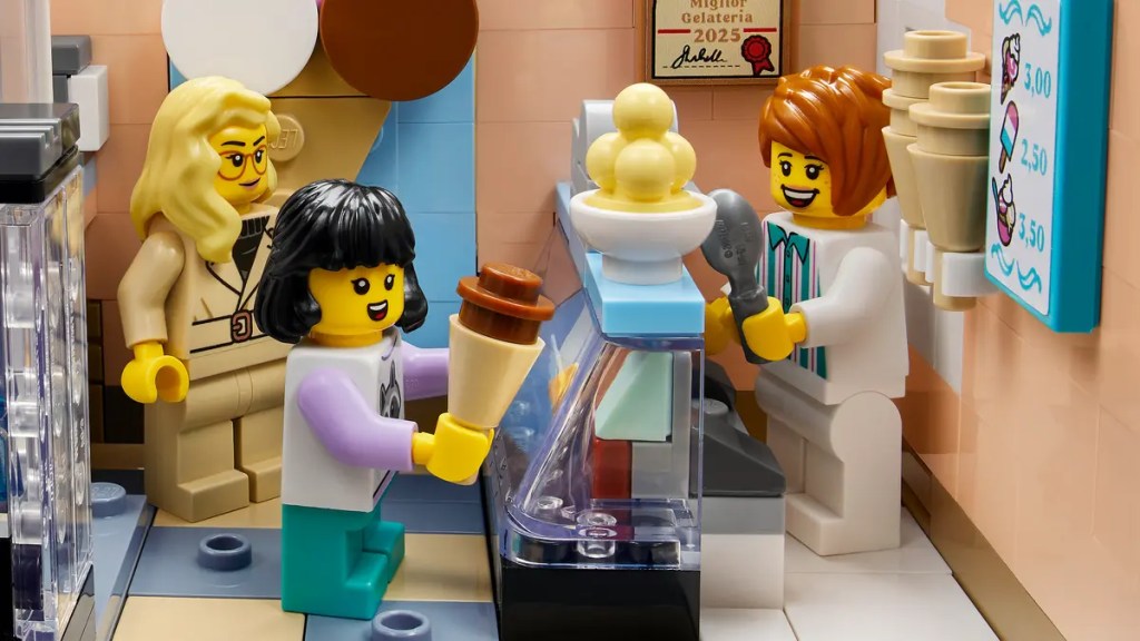 A lego people standing near a ice cream machine