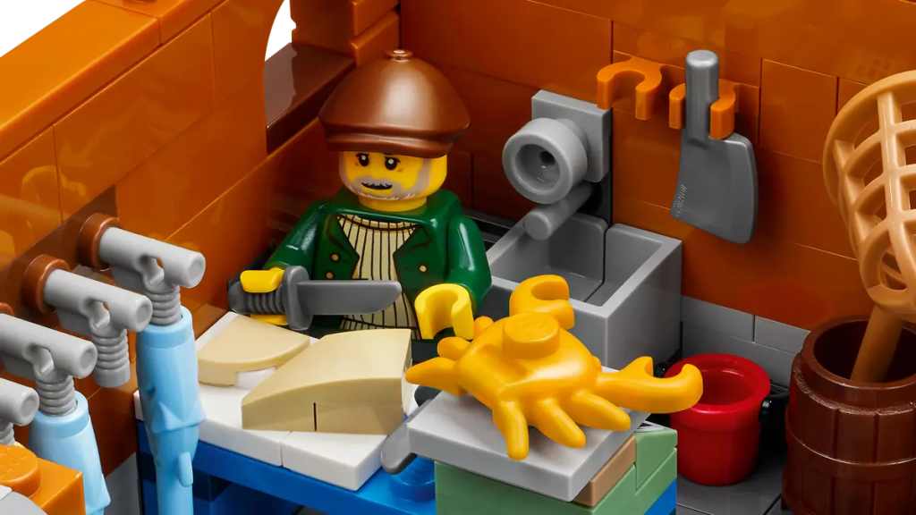 A toy figurine of a man in a kitchen