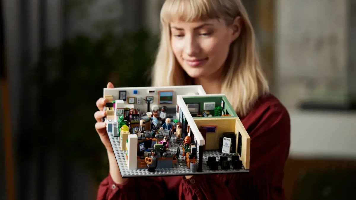 A woman holding a building block