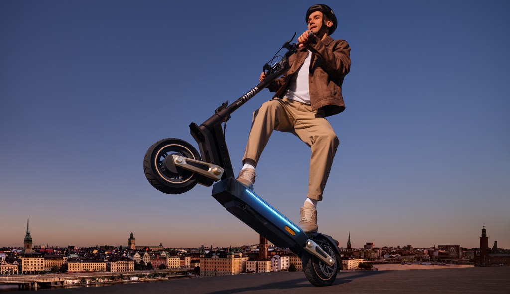 A man riding a scooter