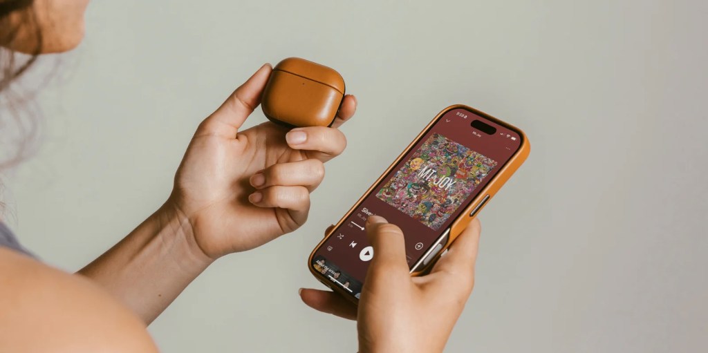 A person holding a phone and a case