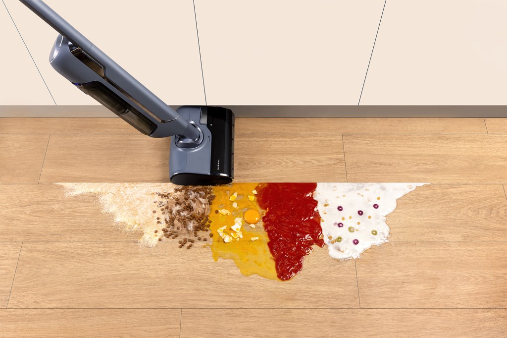 A vacuum cleaner with food on the floor
