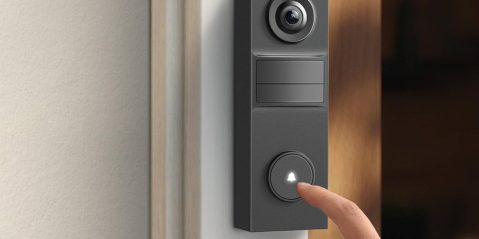 A finger pressing a bell button