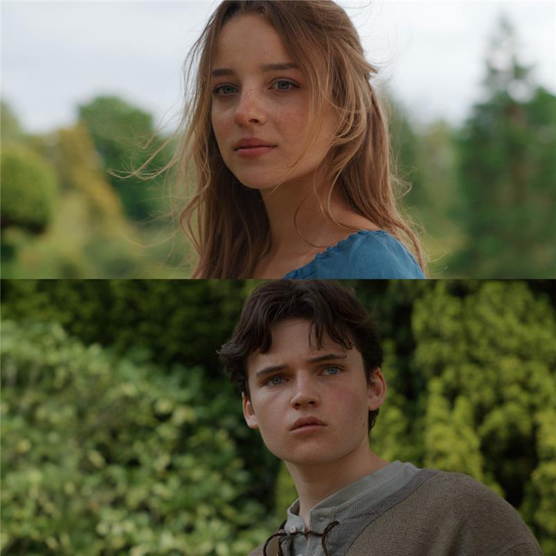 A man and woman looking at camera