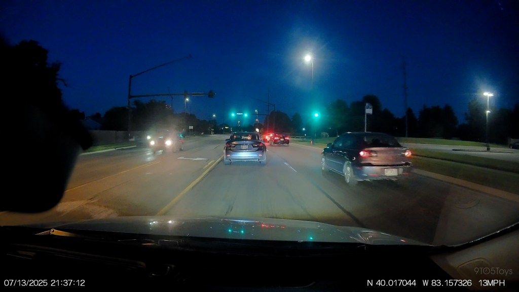 A car driving on a road at night
