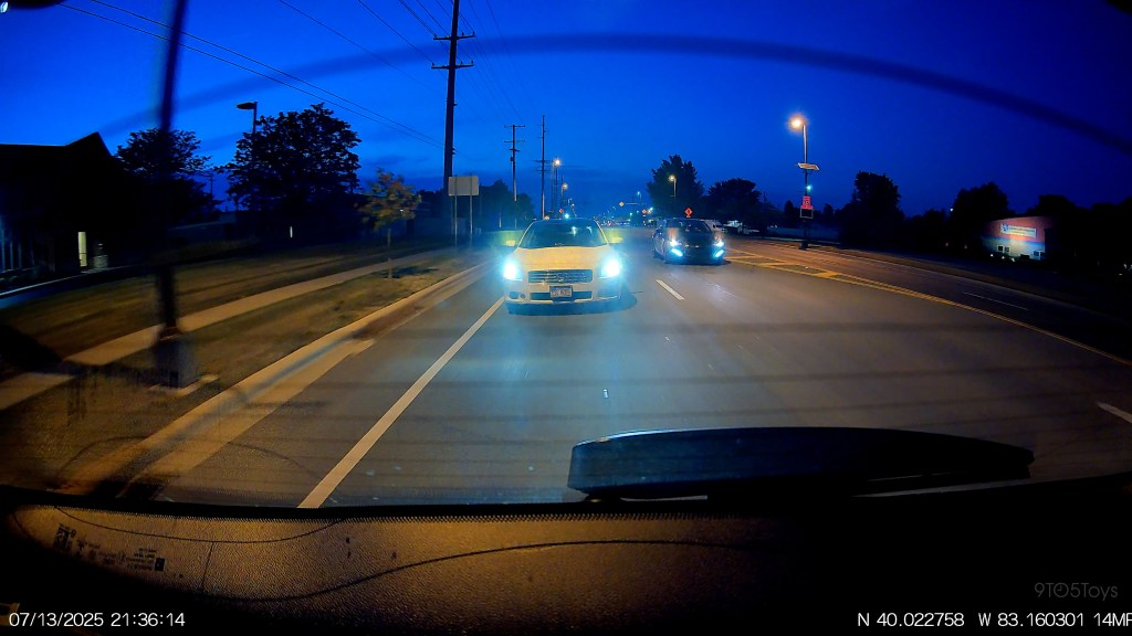 A car driving on a road at night