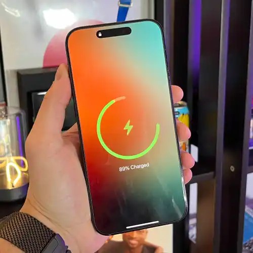 A hand holding a cell phone