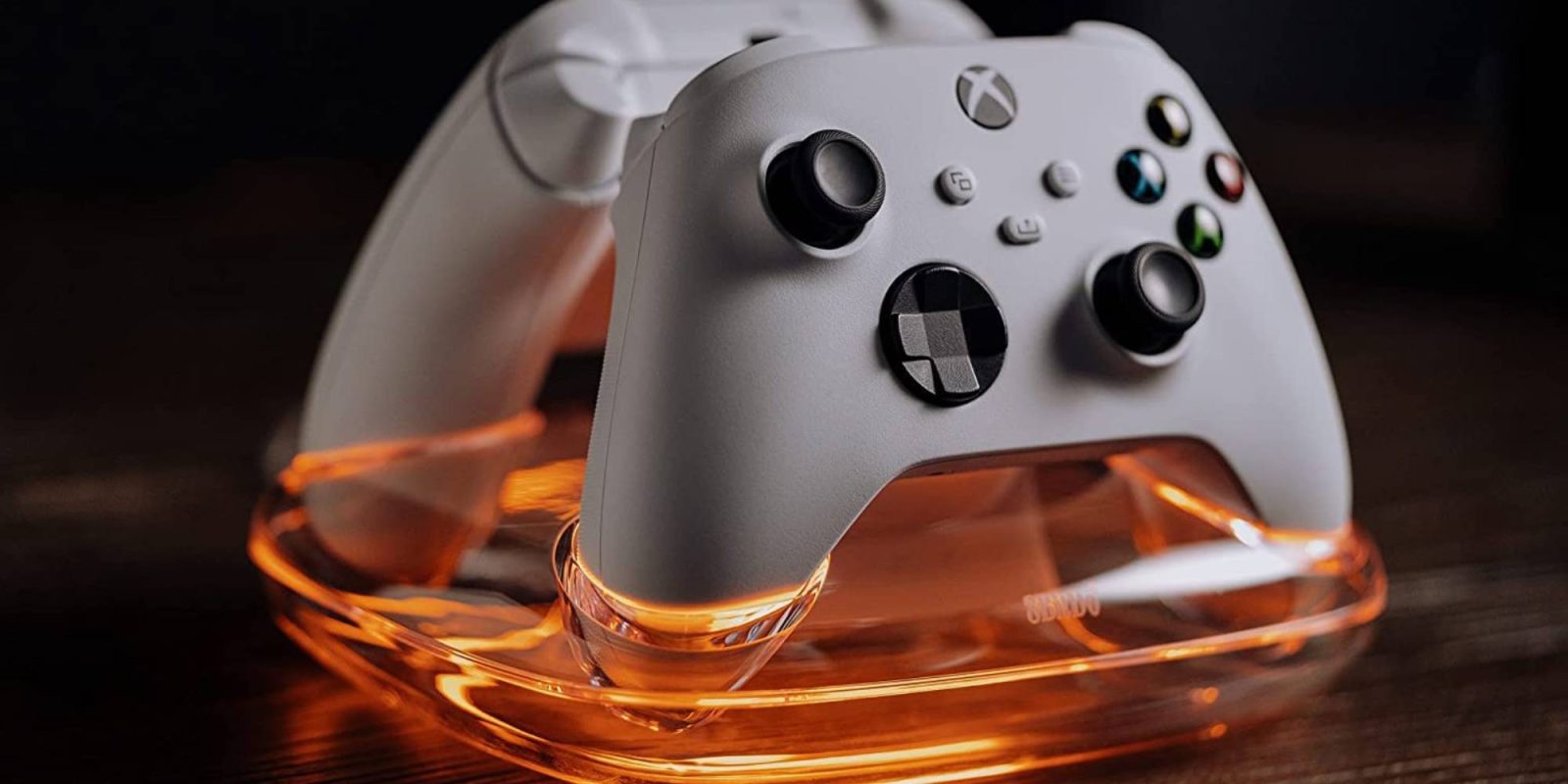 A white video game controller in a clear container