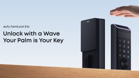 A black electronic device on a wood surface