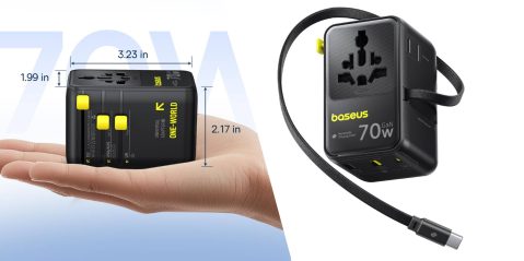 A hand holding a black cube with a black strap