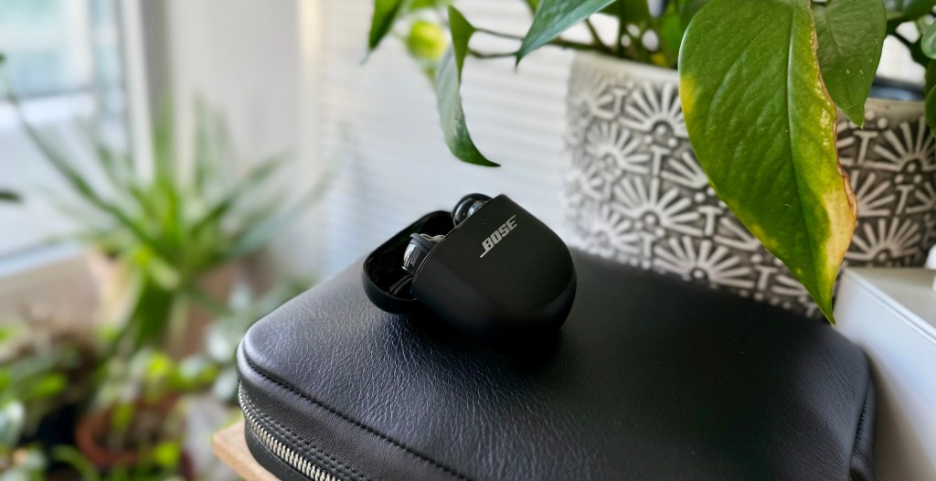 A black case with a black case on a black leather case with a white plant in the background