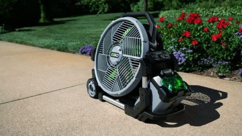 A large fan on a sidewalk