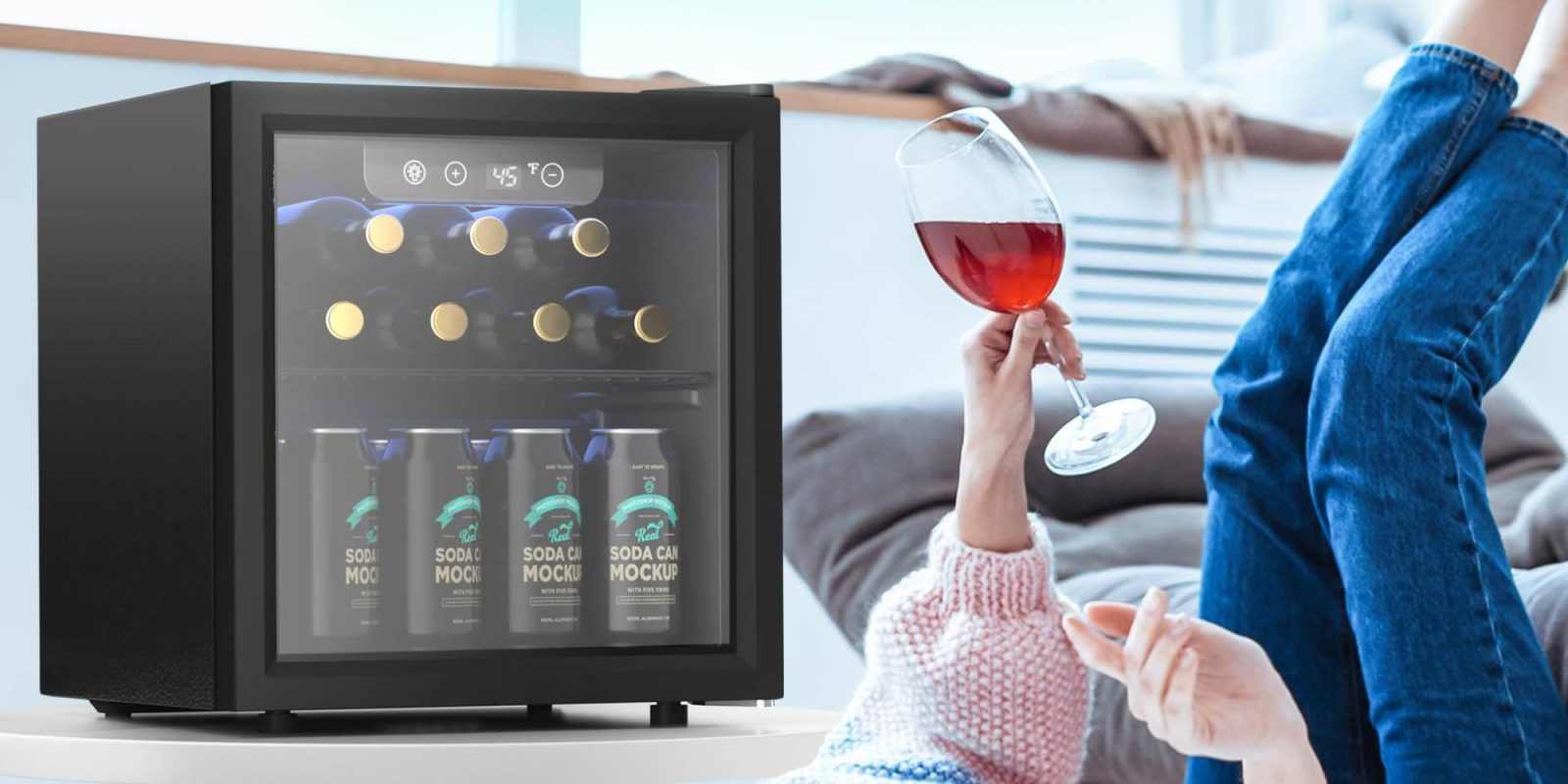 A person holding a glass of wine in front of a refrigerator
