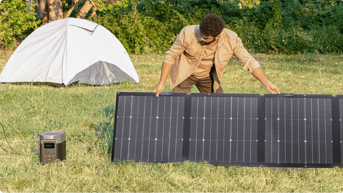 A man holding a solar panel
