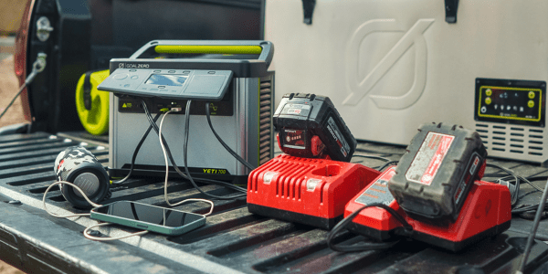 A group of power tools on a black surface