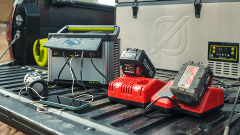 A group of power tools on a black surface