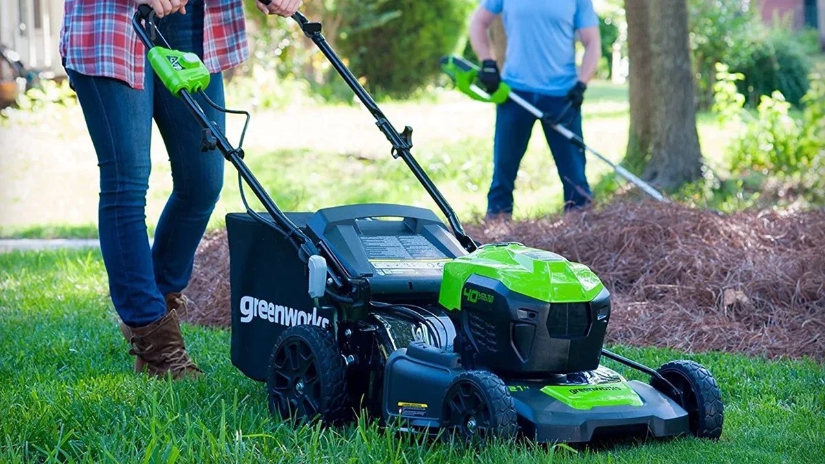 A man mowing a lawn