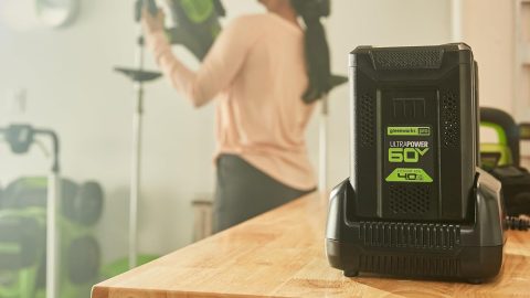 A woman holding a power tool