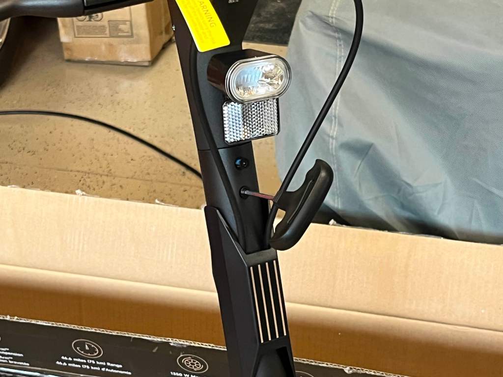 A black bike with a light on it