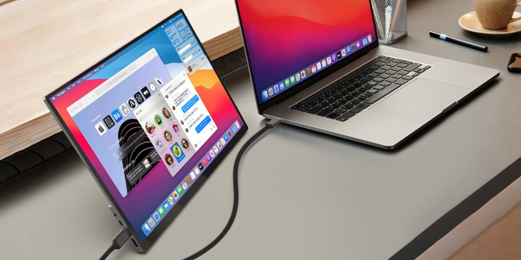 A laptop computer with a cord plugged into it