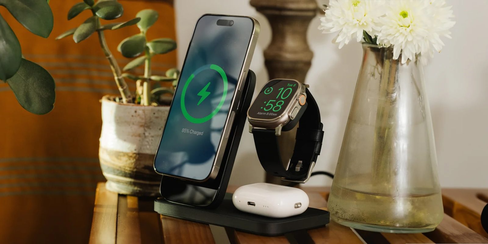 A smart watch and a smartwatch on a wireless charger