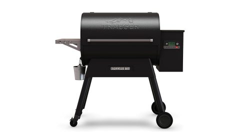 A black barbecue grill with wheels