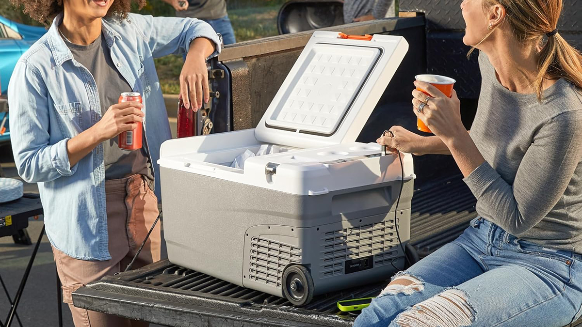 A group of people holding drinks and a cooler
