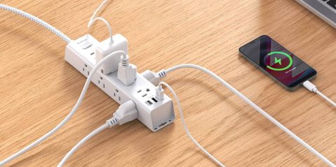 A power strip with cords plugged into it