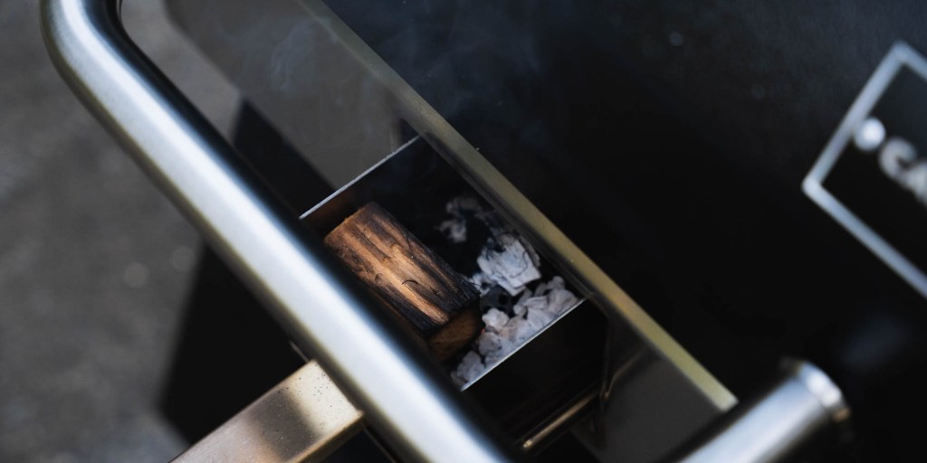 A wood burning in a grill