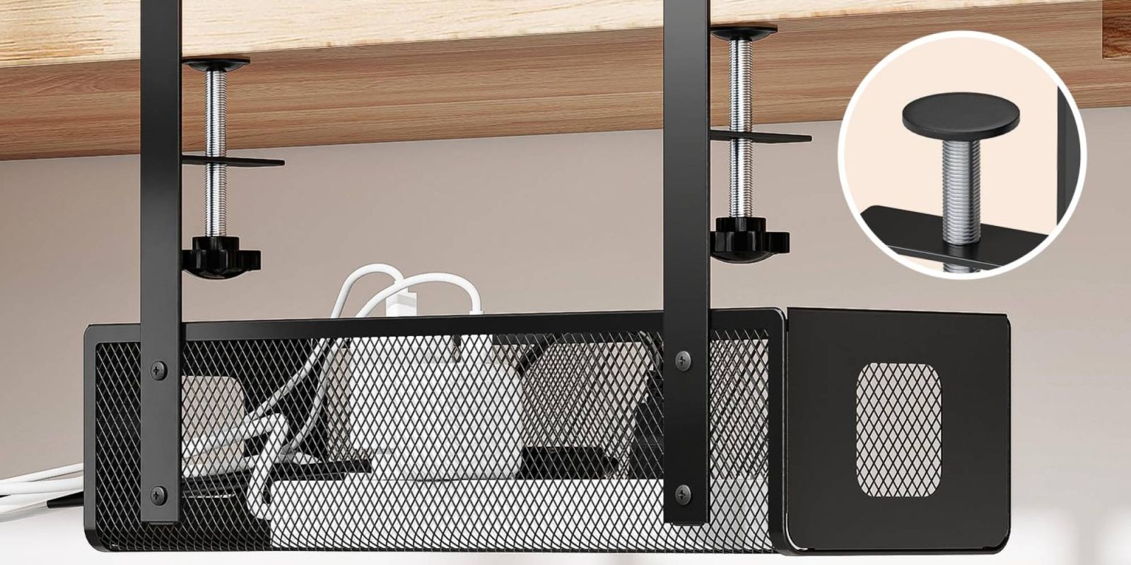 A black metal shelf with a wire mesh basket and white lamps