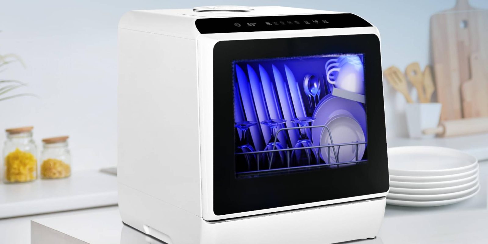 A dishwasher with plates and glasses inside