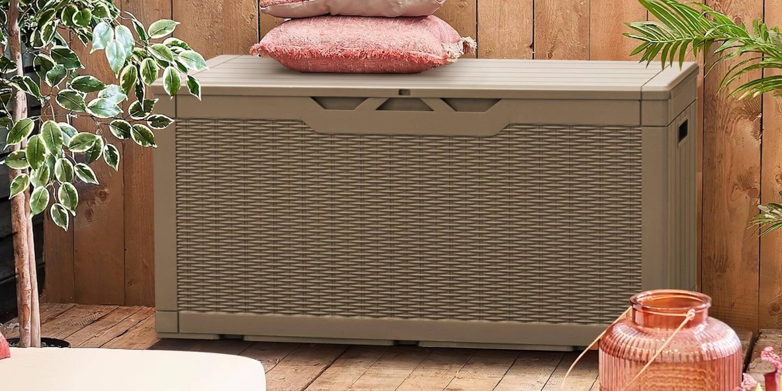 A plastic box with a pile of pillows on top