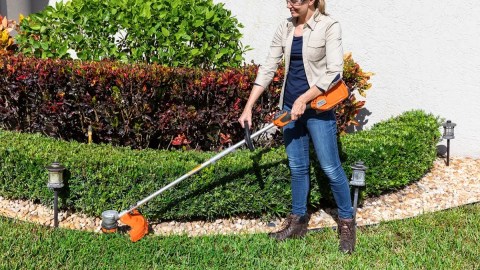 A woman using a trimmer
