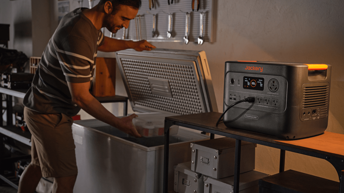 A man opening a refrigerator