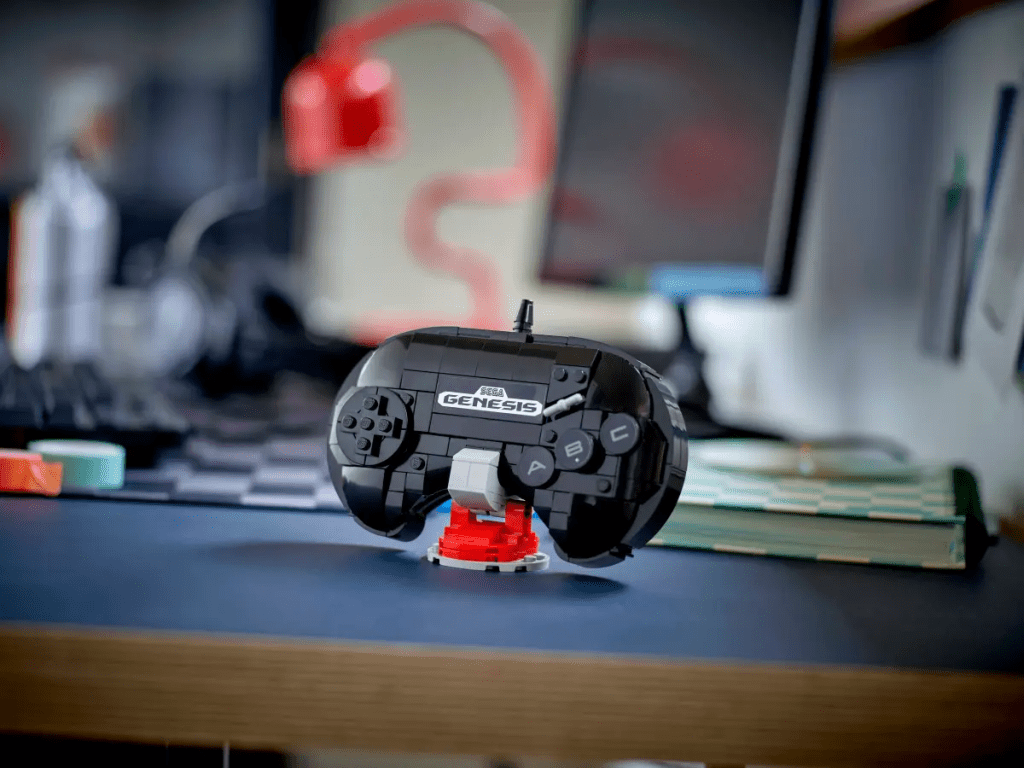 A black and red toy controller on a desk