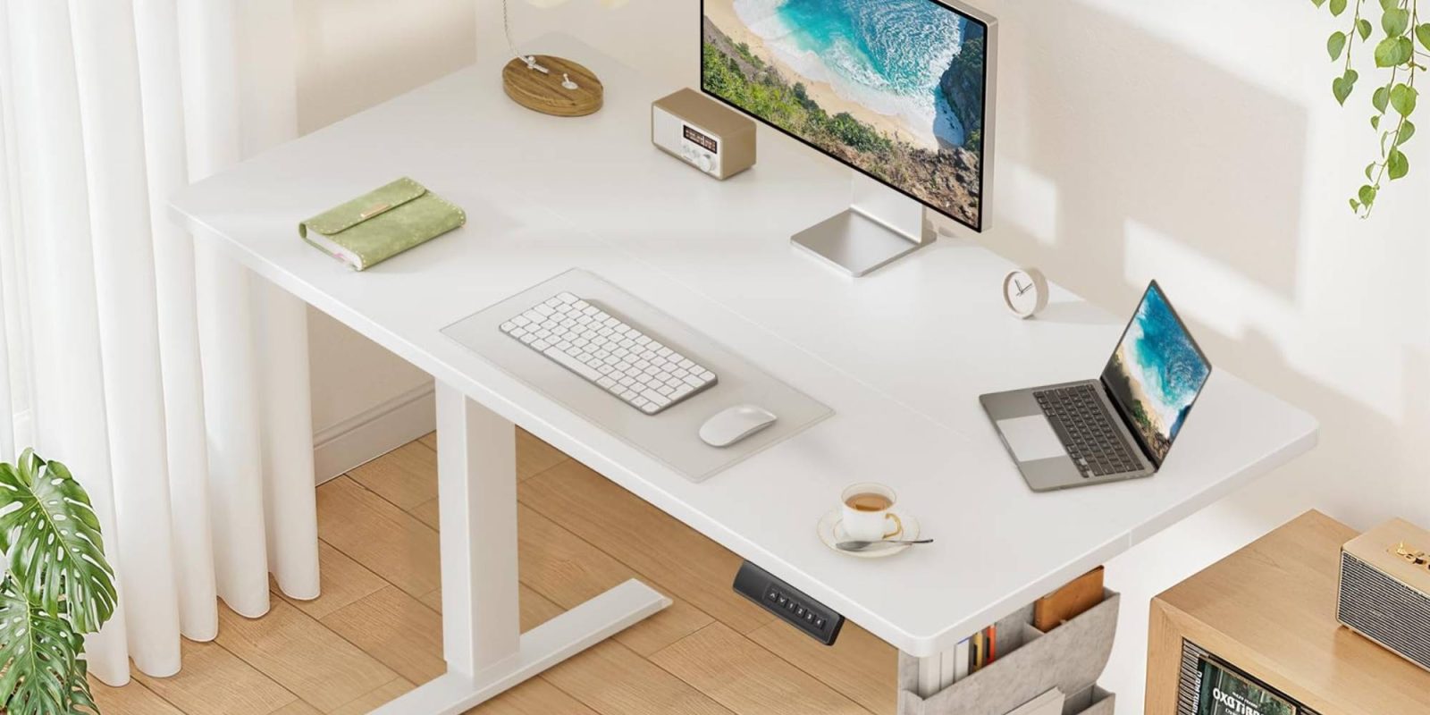 A desk with a computer and a laptop