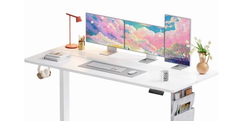 A desk with multiple monitors and a keyboard