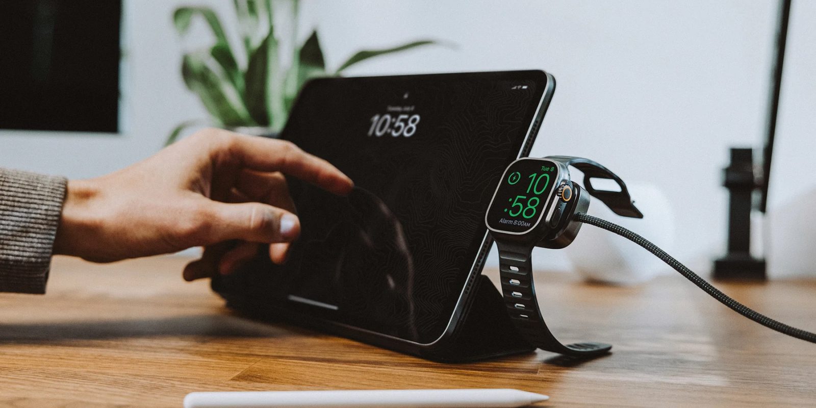A hand touching a smart watch