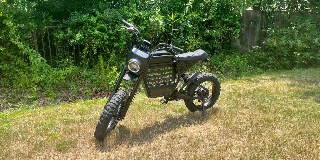 Ride1Up Revv1 DRT e-bike parked in a grassy area