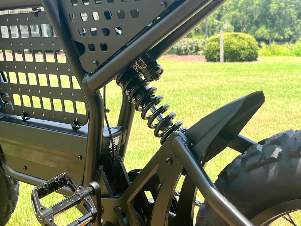A close up of the Ride1Up Revv1 DRT e-bike's rear suspension