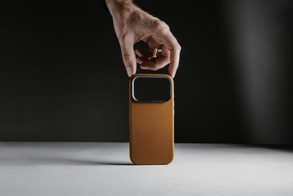 A hand holding a phone